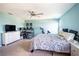 Light-filled bedroom with a walk-in closet and space for a work out and study area at 578 Preserve Pointe Blvd, Davenport, FL 33837