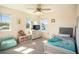Cozy bedroom with a comfortable bed, soft carpet, and natural light from two windows at 578 Preserve Pointe Blvd, Davenport, FL 33837
