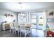 Inviting dining area with a view of the backyard through sliding glass doors at 578 Preserve Pointe Blvd, Davenport, FL 33837
