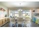 Bright dining area with a chandelier and sliding glass doors to the backyard at 578 Preserve Pointe Blvd, Davenport, FL 33837