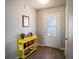 Inviting entryway with decorative door, console table, and wood-look flooring at 578 Preserve Pointe Blvd, Davenport, FL 33837