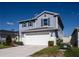 Charming two-story home with a two-car garage, well-manicured lawn, and tidy landscaping at 578 Preserve Pointe Blvd, Davenport, FL 33837