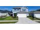 Charming two-story home featuring a well-maintained lawn and a two-car garage at 578 Preserve Pointe Blvd, Davenport, FL 33837