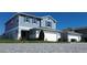Well-kept two-story home with a two-car garage, showcasing a tidy front yard and curb appeal at 578 Preserve Pointe Blvd, Davenport, FL 33837