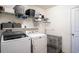 Laundry room with side by side washer and dryer and wire shelving at 578 Preserve Pointe Blvd, Davenport, FL 33837