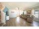 Bright, open living room features wood-look floors, neutral colors, and comfortable seating at 578 Preserve Pointe Blvd, Davenport, FL 33837