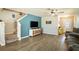 Spacious living room with modern entertainment center and staircase at 578 Preserve Pointe Blvd, Davenport, FL 33837