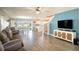 Spacious living room with wood-look flooring and ample natural light at 578 Preserve Pointe Blvd, Davenport, FL 33837