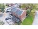 Aerial view from the rear showing brick exteriors, back patios, and dedicated parking spaces at 5850 Cypress Gardens Blvd # 206, Winter Haven, FL 33884