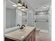 Bathroom with white tile shower and sink at 5850 Cypress Gardens Blvd # 206, Winter Haven, FL 33884