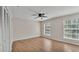 Bedroom features wood-look floors, ceiling fan, and ample closet space at 5850 Cypress Gardens Blvd # 206, Winter Haven, FL 33884