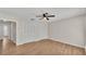 Bedroom features wood-look floors, ceiling fan, and two closets at 5850 Cypress Gardens Blvd # 206, Winter Haven, FL 33884
