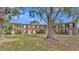 Charming brick townhomes featuring black shutters, white doors, and a spacious common area at 5850 Cypress Gardens Blvd # 206, Winter Haven, FL 33884