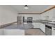 Bright kitchen featuring white cabinets and a convenient breakfast bar at 5850 Cypress Gardens Blvd # 206, Winter Haven, FL 33884