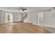 Spacious living room showcasing laminate floors, neutral walls, and natural light at 5850 Cypress Gardens Blvd # 206, Winter Haven, FL 33884