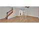 Open-concept living area with staircase and modern flooring at 5850 Cypress Gardens Blvd # 206, Winter Haven, FL 33884