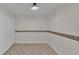 A clean, tile-floored room with light walls and a closet at 5850 Cypress Gardens Blvd # 206, Winter Haven, FL 33884