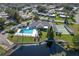 Breathtaking aerial view of the home showcasing the pool, tennis court, and waterfront location at 6053 Southern Oaks Se Dr, Winter Haven, FL 33884