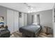 Cozy bedroom with natural light, a ceiling fan, and ample closet space at 6053 Southern Oaks Se Dr, Winter Haven, FL 33884