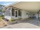 Charming home with landscaped front yard, a covered parking area, and a welcoming entryway at 6053 Southern Oaks Se Dr, Winter Haven, FL 33884