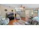 Cozy living room with comfortable seating, wood floors, and access to a patio area at 6053 Southern Oaks Se Dr, Winter Haven, FL 33884
