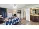 Spacious main bedroom with an ensuite bathroom featuring wood-style flooring at 6053 Southern Oaks Se Dr, Winter Haven, FL 33884