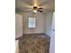 Cozy dining area with wood-look flooring, a ceiling fan, and natural light from a window at 639 2Nd St, Polk City, FL 33868