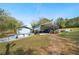 Exterior shot of the home and detached garage with boat and tractor storage at 660 Duggers Way, Lake Wales, FL 33859