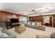 Cozy living room showcasing wood accents, multiple sofas, and carpeted floors at 660 Duggers Way, Lake Wales, FL 33859