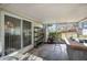 Enclosed patio with sliding glass doors and patio furniture, perfect for outdoor dining at 660 Duggers Way, Lake Wales, FL 33859