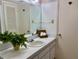 Bathroom view with a sink, mirror, toilet, and closet at 700 Mirror Nw Ter # 111, Winter Haven, FL 33881