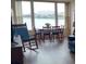 Inviting living room with a scenic water view, dining table, and comfortable seating at 700 Mirror Nw Ter # 111, Winter Haven, FL 33881