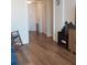 View of the living room with new wood-style flooring and neutral wall colors at 700 Mirror Nw Ter # 111, Winter Haven, FL 33881