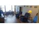 Comfortable living room featuring a dining area and waterfront view at 700 Mirror Nw Ter # 111, Winter Haven, FL 33881