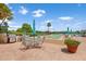 Outdoor patio area featuring a shuffleboard court and grilling area at 700 Mirror Nw Ter # 111, Winter Haven, FL 33881