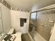 View of enclosed shower with tile at 700 Mirror Nw Ter # 111, Winter Haven, FL 33881