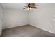 Neutral bedroom featuring a ceiling fan, carpeting, and a spacious layout ready for personalization at 7016 Village Dr, Lake Wales, FL 33898