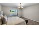 Serene bedroom featuring a scenic outdoor view and a comfortable bed at 7016 Village Dr, Lake Wales, FL 33898