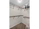 Walk-in closet with installed metal racks and carpet flooring at 7016 Village Dr, Lake Wales, FL 33898