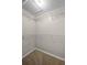 Walk-in closet with installed white metal racks and carpet flooring at 7016 Village Dr, Lake Wales, FL 33898