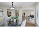 Open-concept dining area with views of the kitchen, living room, and stylish furnishings, perfect for entertaining at 7016 Village Dr, Lake Wales, FL 33898