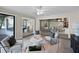 Inviting living room with neutral tones and stylish decor, seamlessly connecting to other living spaces at 7016 Village Dr, Lake Wales, FL 33898