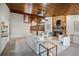 Open-concept living room with stone fireplace and cozy seating arrangement at 7016 Village Dr, Lake Wales, FL 33898