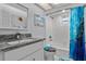 Cozy bathroom featuring modern gray granite vanity top and turtle themed decor at 734 Canberra Rd, Winter Haven, FL 33884