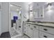 Elegant bathroom with a granite vanity, decorative lighting, and access to the tub and toilet at 734 Canberra Rd, Winter Haven, FL 33884