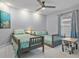 Charming bedroom featuring twin beds with playful mermaid themed bedding and decor at 734 Canberra Rd, Winter Haven, FL 33884