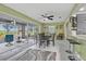 Bright dining area with access to a screened patio showcasing outdoor seating at 734 Canberra Rd, Winter Haven, FL 33884