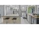 Bright kitchen with a breakfast bar, granite countertops, and stainless steel appliances at 734 Canberra Rd, Winter Haven, FL 33884