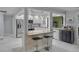 Bright kitchen with a breakfast bar, granite countertops, and stainless steel appliances at 734 Canberra Rd, Winter Haven, FL 33884