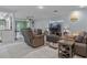 Open-concept living space featuring comfortable seating and seamless flow to other areas at 734 Canberra Rd, Winter Haven, FL 33884